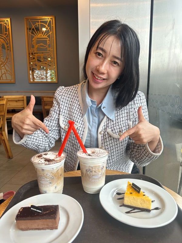 Jinsoo and Kla at a café in Laos